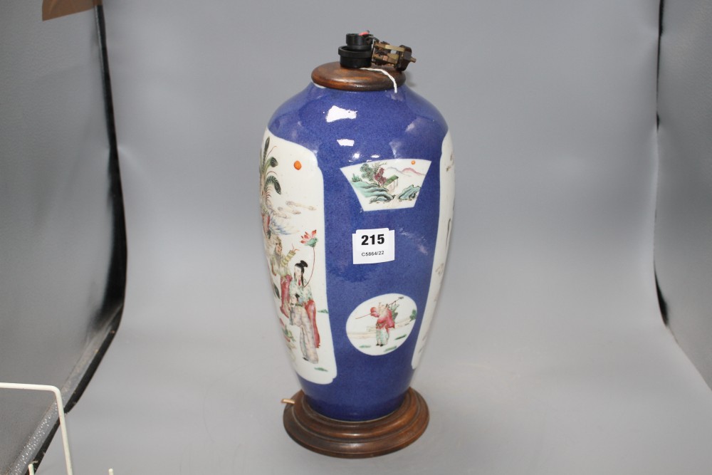 A 19th century Chinese famille rose baluster vase, now cut down and mounted as a table lamp, decorated with panels of immortals